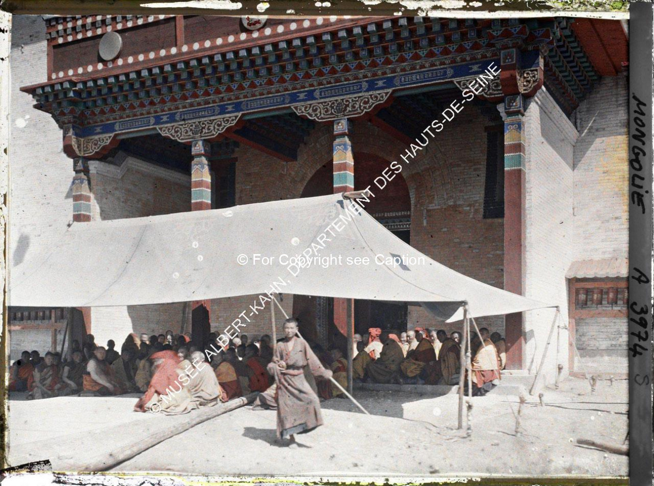Monks gathering in front of Janraiseg Temple. Musée Albert-Kahn. A3974S. Photo by Stéphane Passet, 2